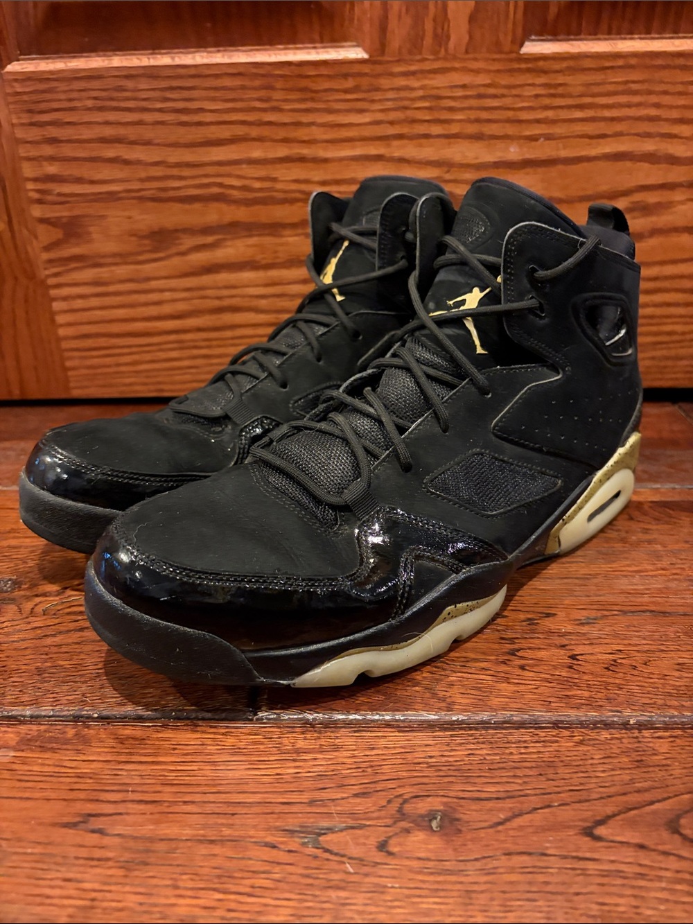 Jordan Men's Black and Gold High-Top Sneakers
